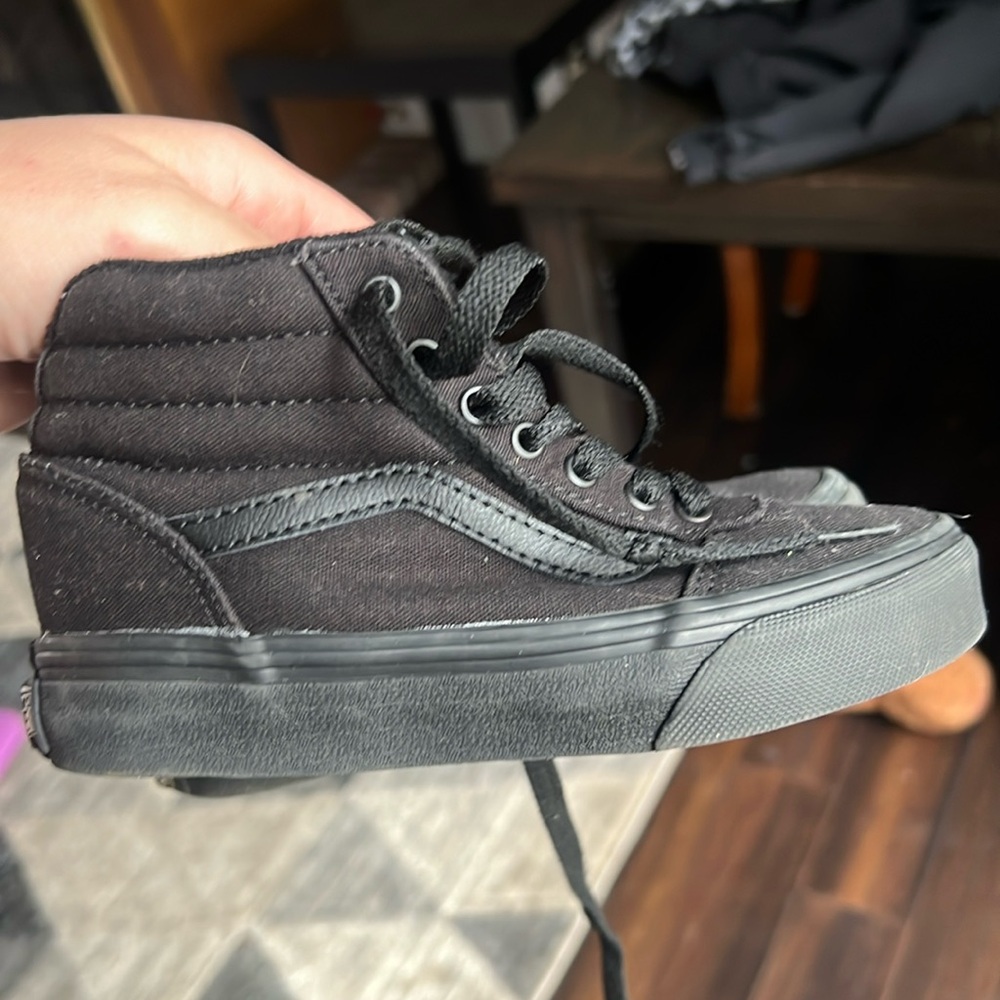 Kids high top vans size 12 in the color black.